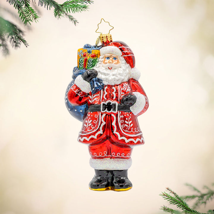 Folklore Father Christmas ornament. With his folk pattern coat and gift sack of presents. View of front. 