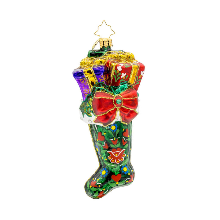 Folklore Charm ornament. This emerald, green stocking is adorned with intricate folk art designs, vibrant colors, and gifts coming out the top. View of front. 