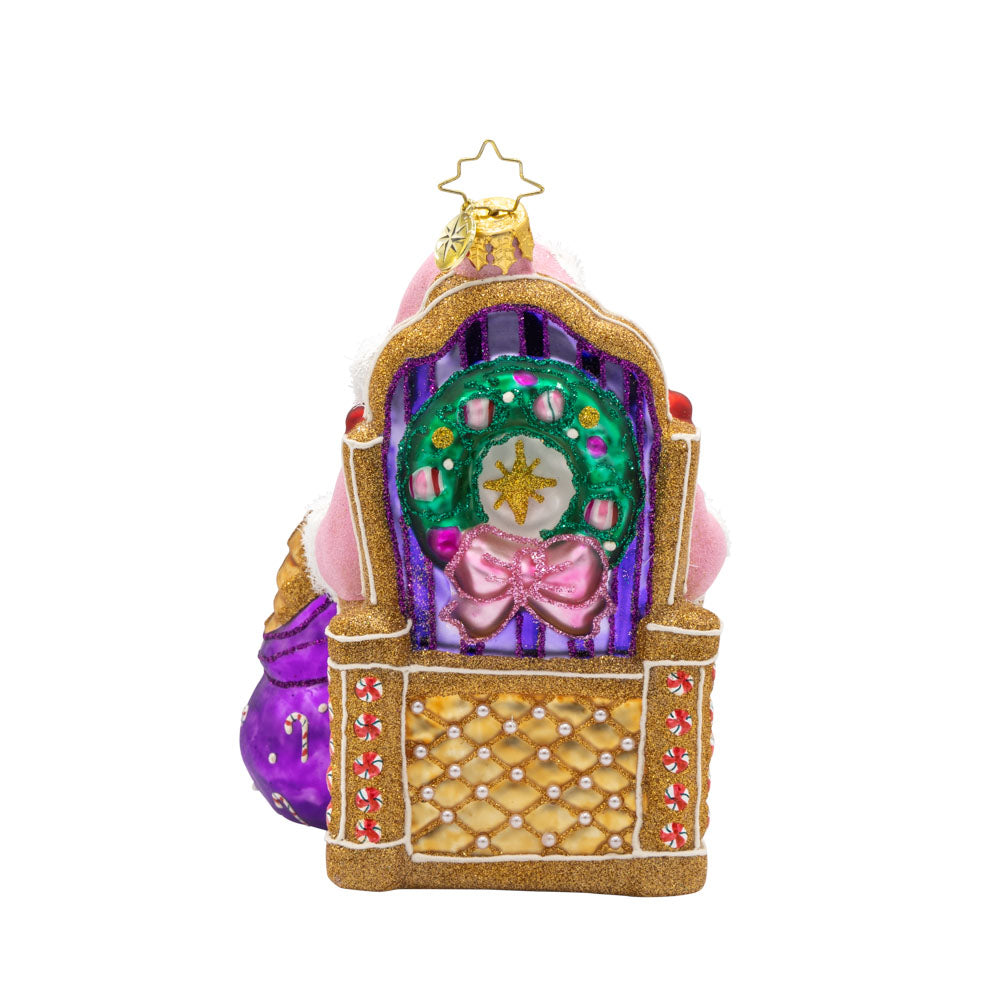 Sweet Tooth Santa ornament. Features Santa in a pink suit surrounded by candy canes, cookies, and other delicious treats. View of back.