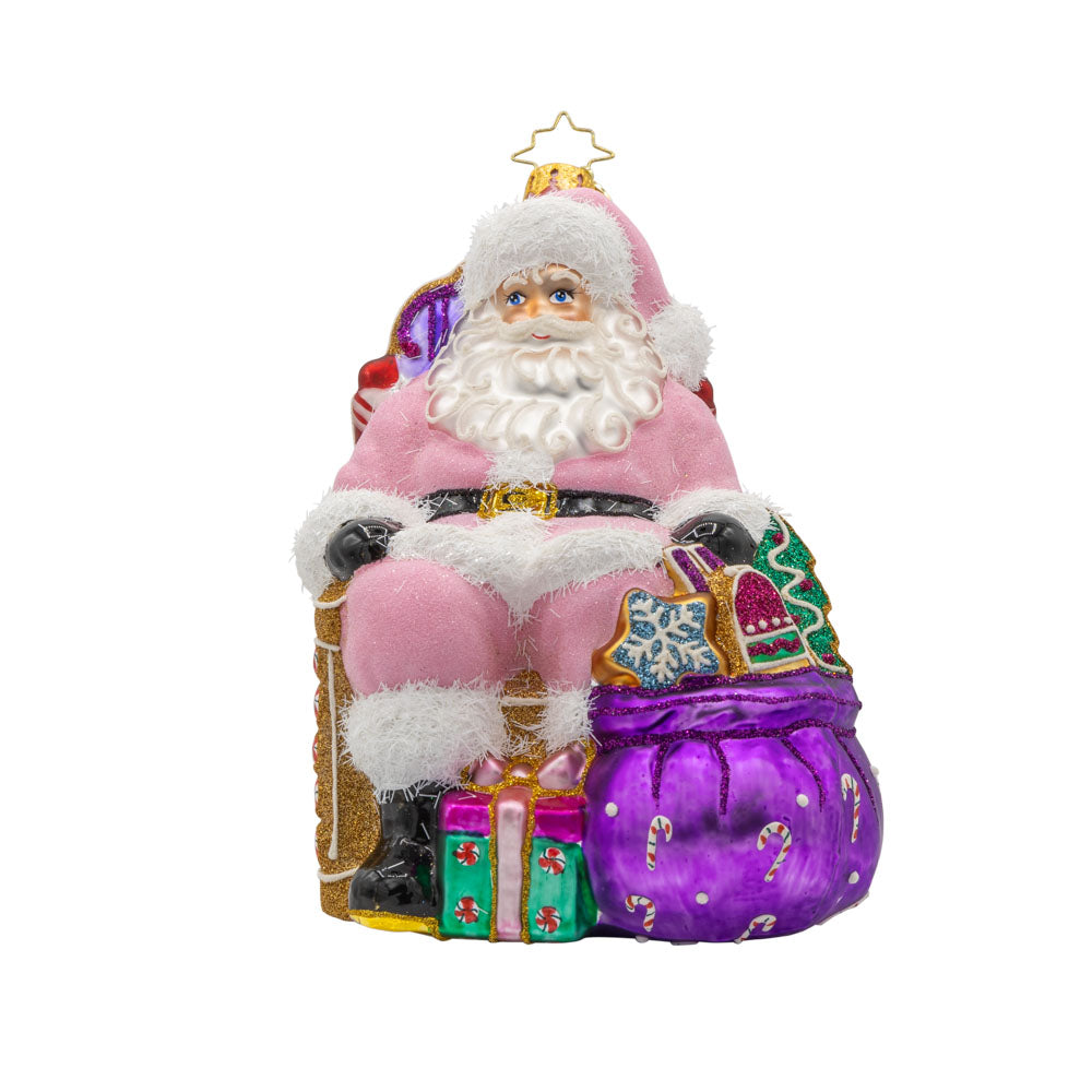 Sweet Tooth Santa ornament. Features Santa in a pink suit surrounded by candy canes, cookies, and other delicious treats. View of front.