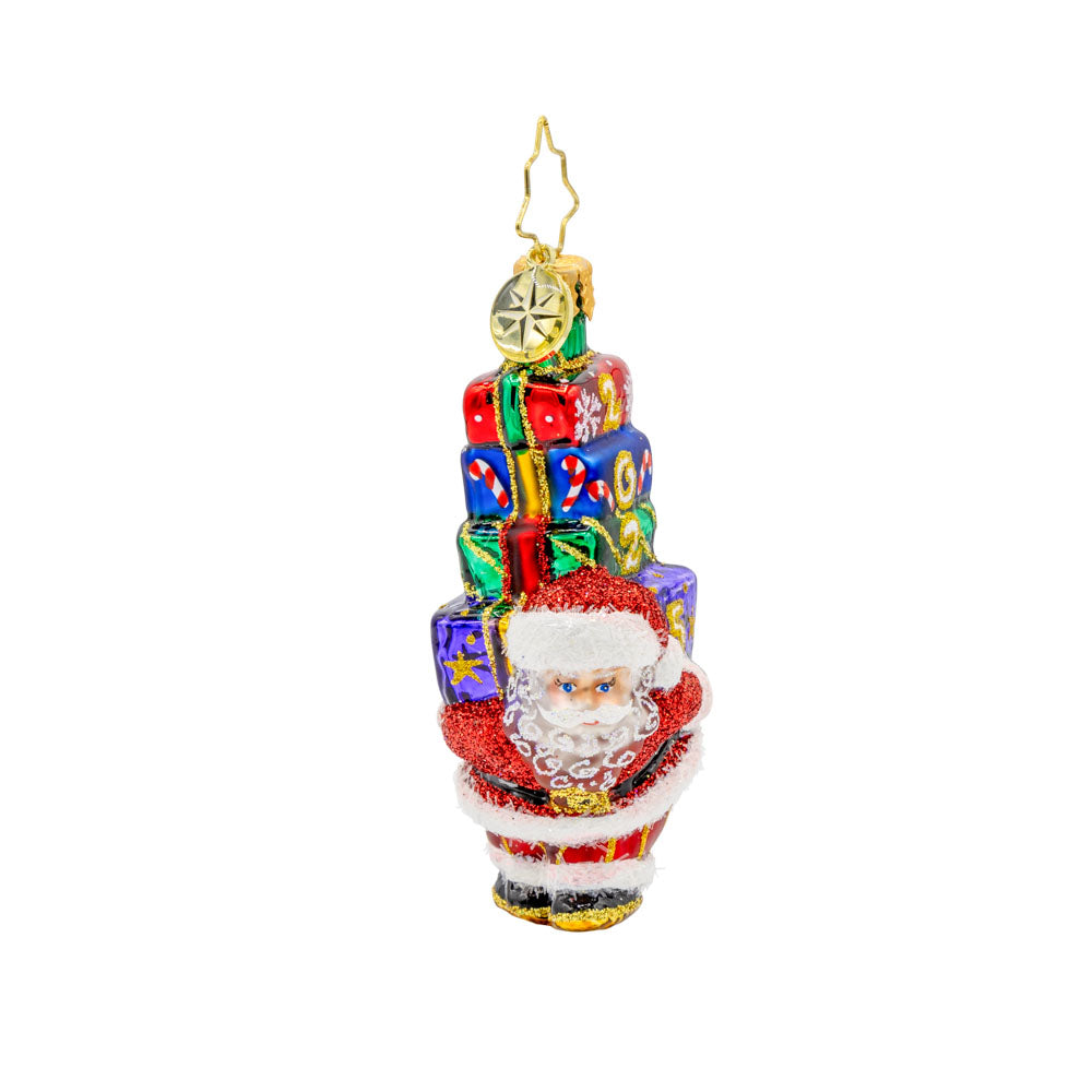 Gifts Galore for 2025 Gem ornament. Santa carries a stack of gifts on his back dated "2025." View of left side.