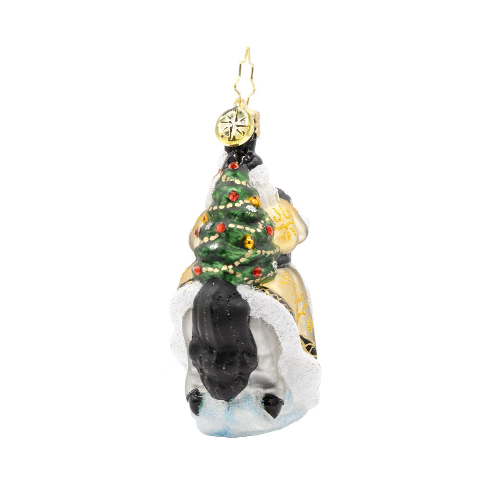 Golden Coat Calvary Gem ornament. Santa rides a white horse with a black mane, decorated in gold with a Christmas tree on his back. View of right side.