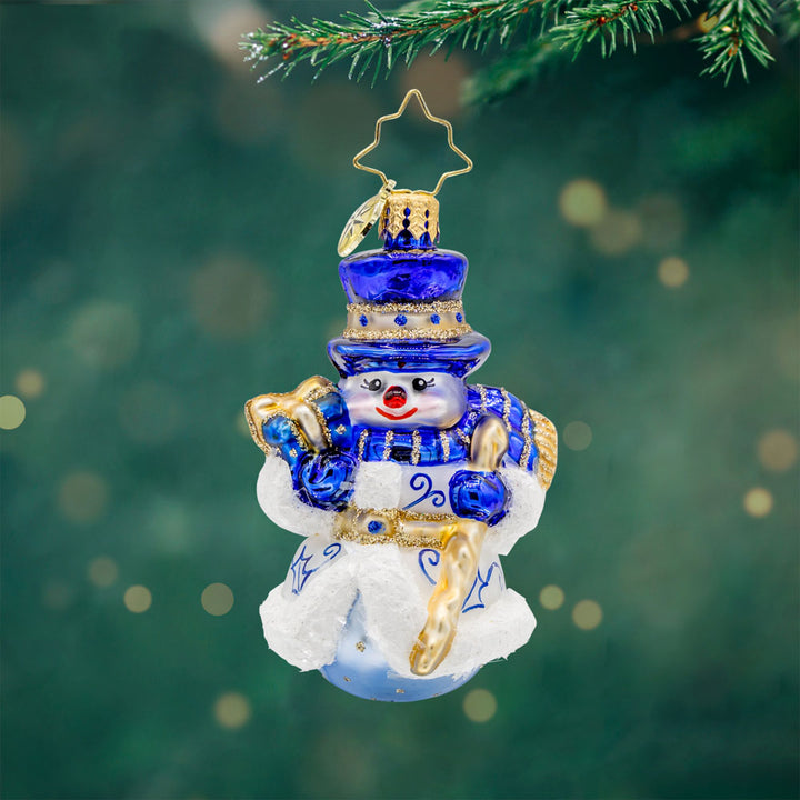 Charming Chinoiserie Snowman Gem ornament. Adorned in robes reminiscent of European Chinoiserie, in a blend of snow white and sapphire blue. View of front.  