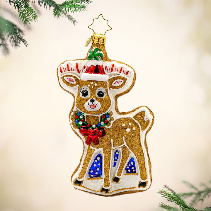 Doughy Dasher ornament. A cookie shaped like a deer in festive gear. View of front. 