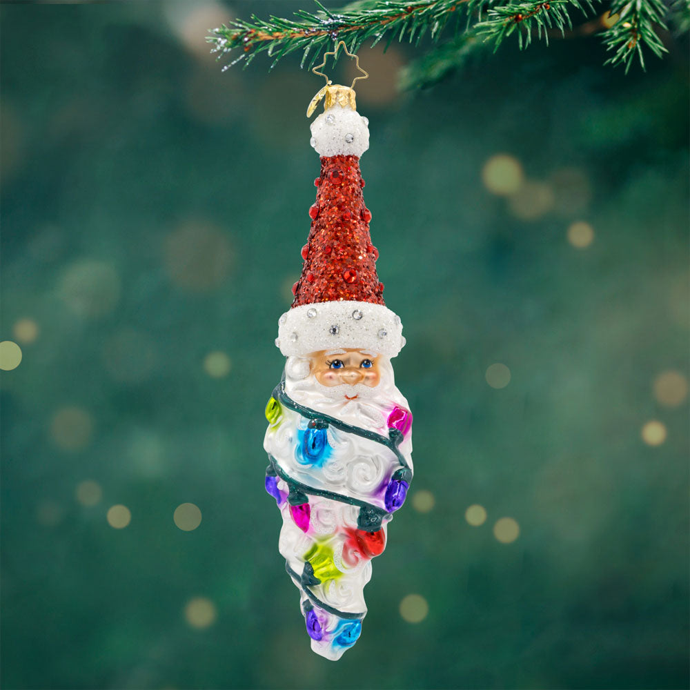 Twinkling Twist ornament. Features Santa's head, with a colorful string of lights cascading down his long beard. View of front.