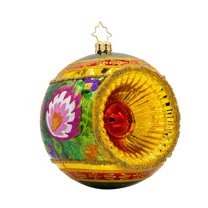 Polish Folk Drop ornament. Hand painted polish folk designs with a single reflector. View of front left.