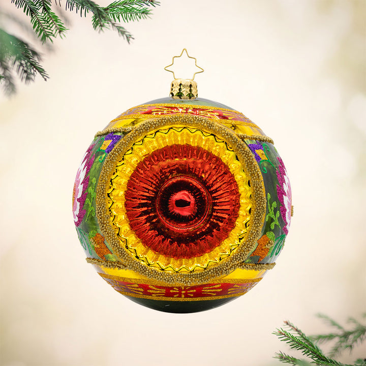 Polish Folk Drop ornament. Hand painted polish folk designs with a single reflector. View of front.