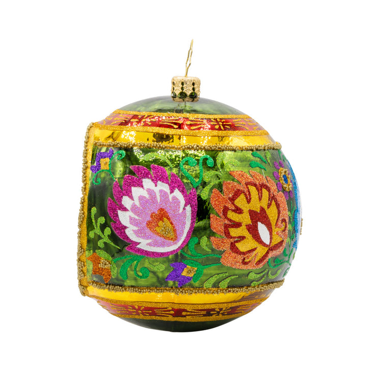 Polish Folk Drop ornament. Hand painted polish folk designs with a single reflector. View of right side.