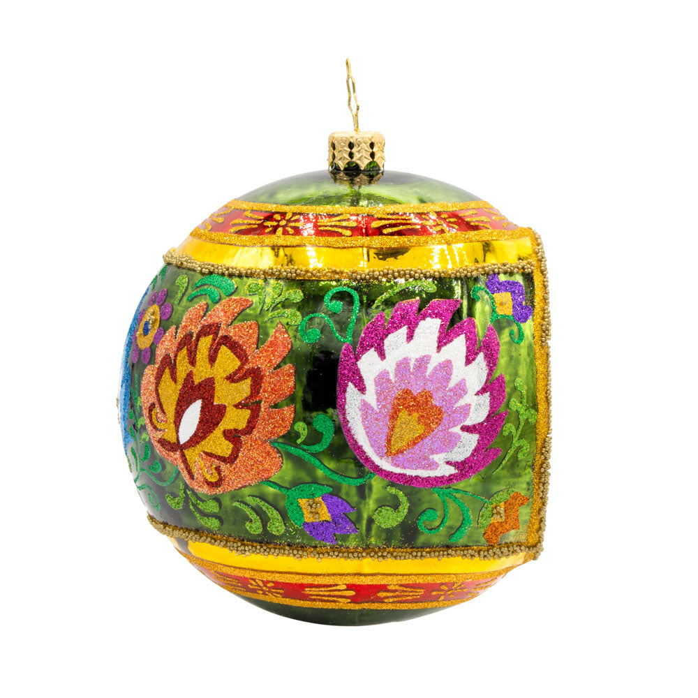 Polish Folk Drop ornament. Hand painted polish folk designs with a single reflector. View of left side.