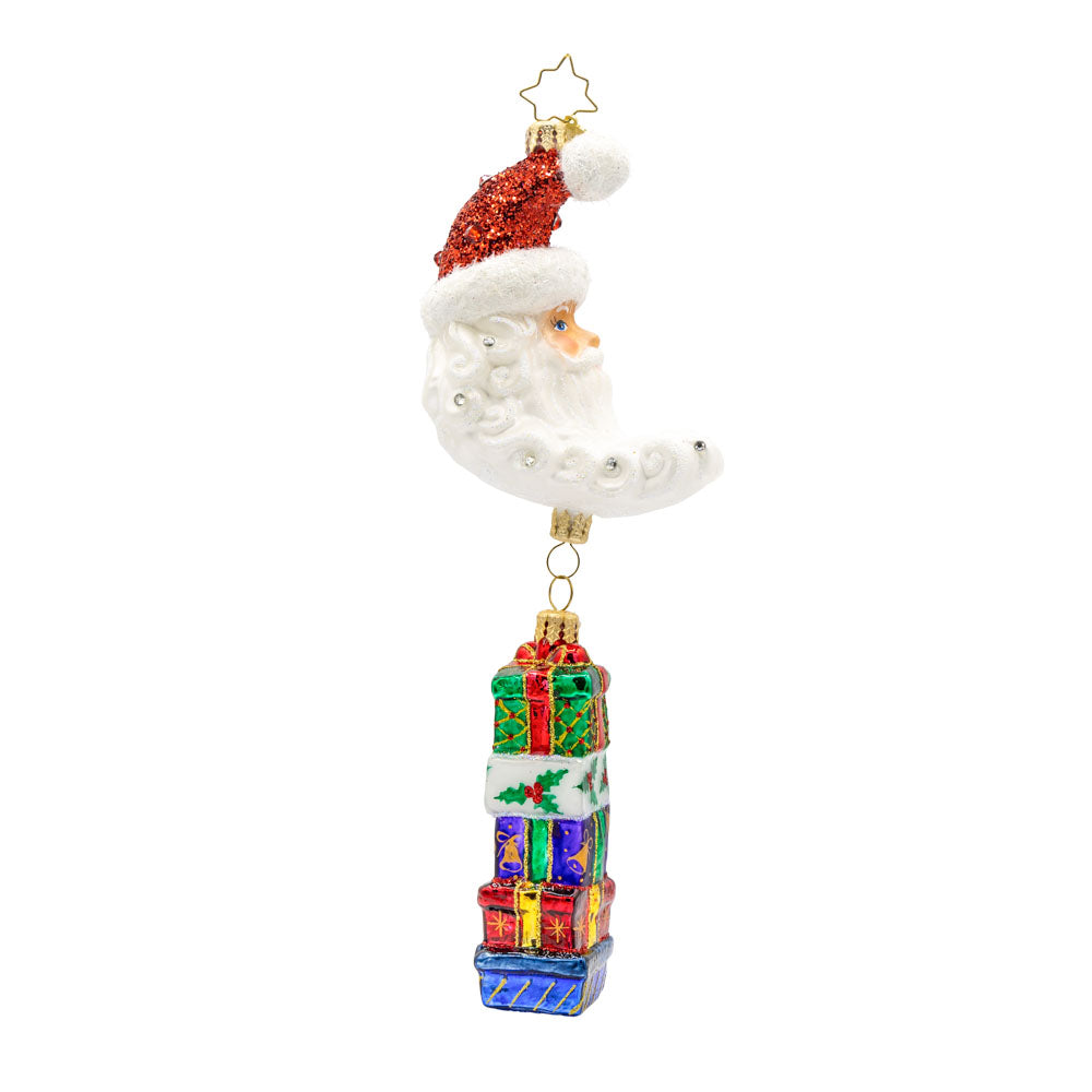 Lunar Treasures ornament. Santa's head in the shape of a crescent moon, with a stack of gifts dangling below. View of front.