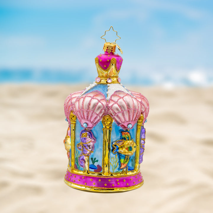 Carousel by the Sea ornament. This ornament features a beautifully detailed carousel adorned with sea creatures like dolphins, seahorses, and starfish. View of front. 