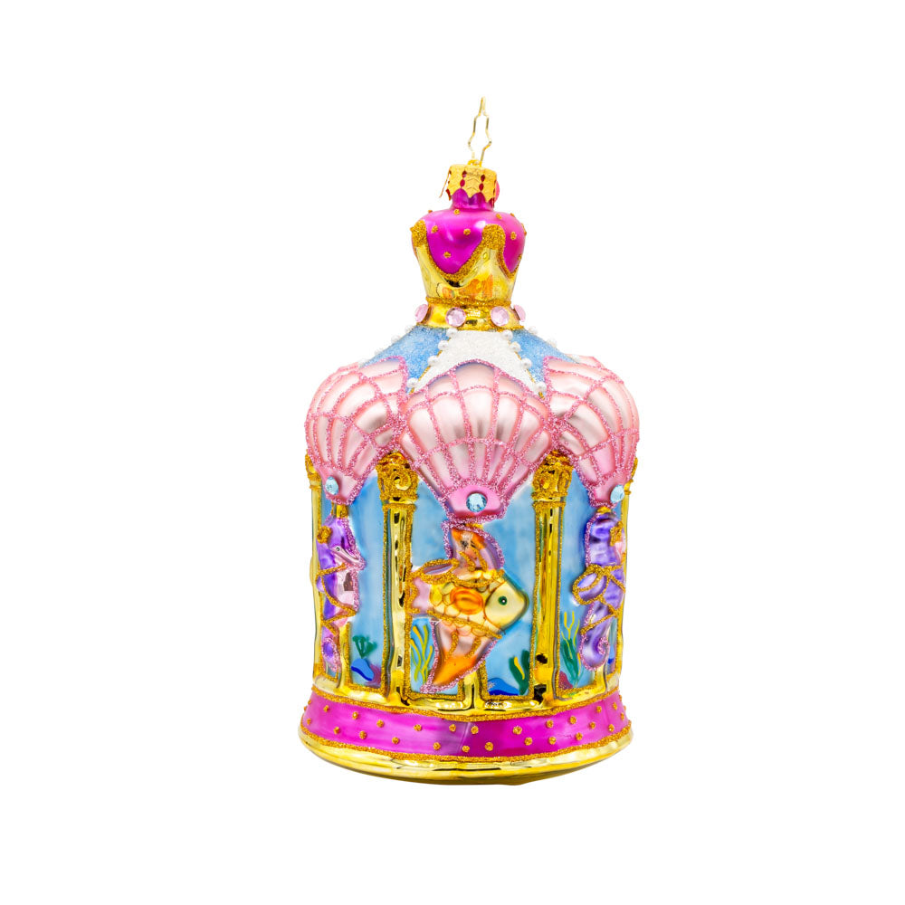 Carousel by the Sea ornament. This ornament features a beautifully detailed carousel adorned with sea creatures like dolphins, seahorses, and starfish. View of left side.