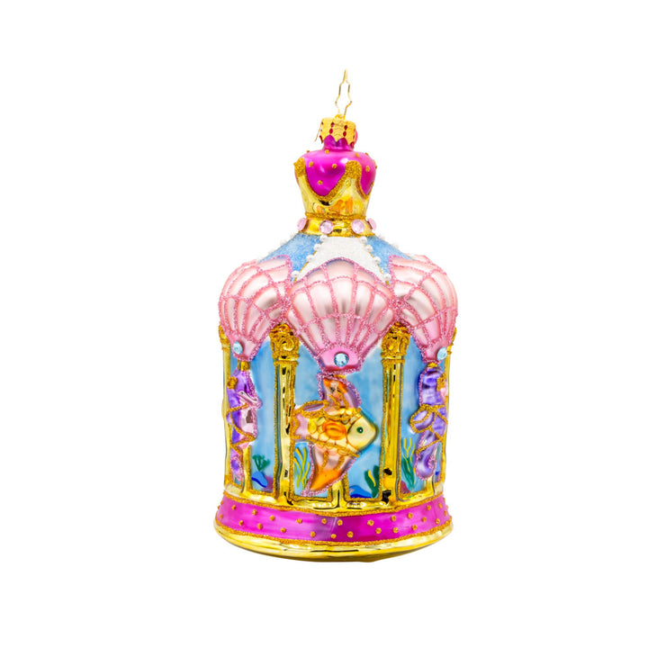Carousel by the Sea ornament. This ornament features a beautifully detailed carousel adorned with sea creatures like dolphins, seahorses, and starfish. View of left side.