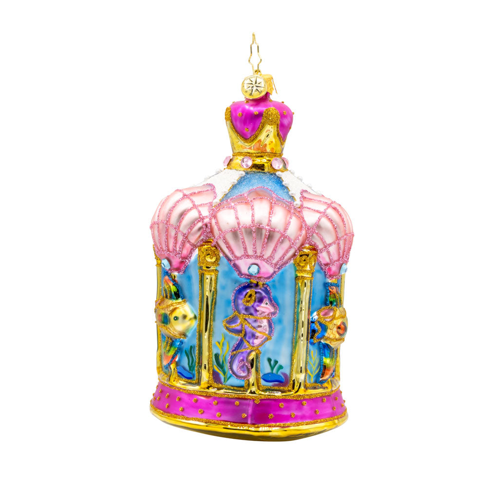 Carousel by the Sea ornament. This ornament features a beautifully detailed carousel adorned with sea creatures like dolphins, seahorses, and starfish. View of right side.