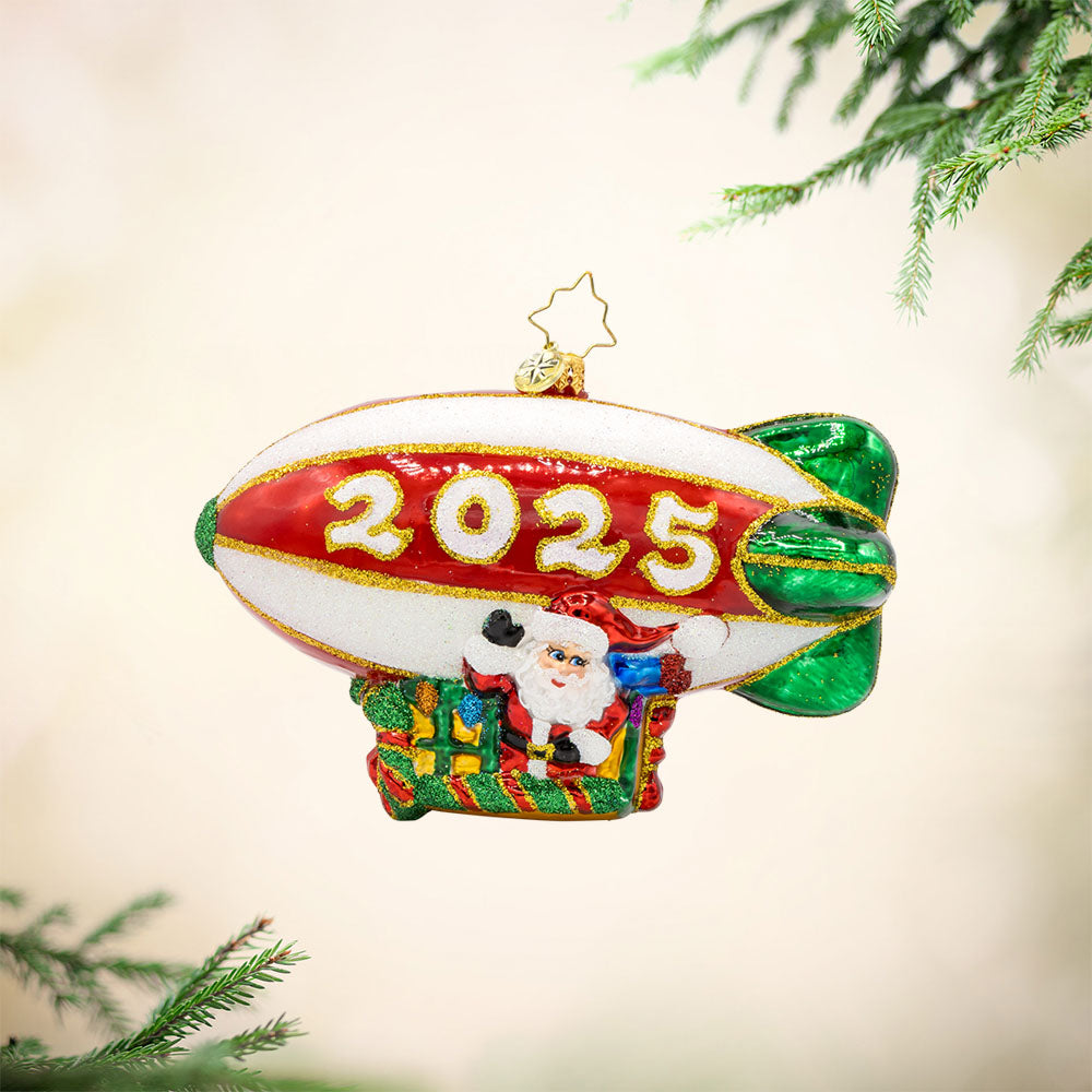 Flying Over the Years ornament. This ornament features Santa piloting a blimp, dated "2025." View of front.