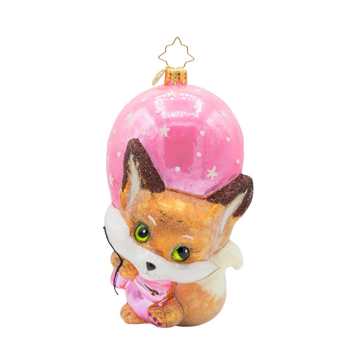 Pink Foxy Float ornament. Featuring a baby fox holding onto a pink balloon. View of front.