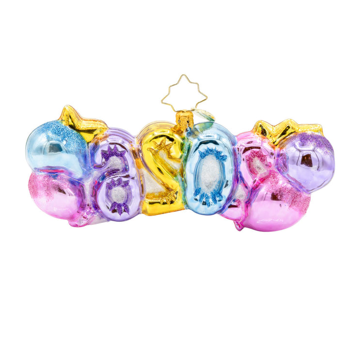 Cheers to 2026 ornament. "2026" shaped ballons in festive colors of pink, gold, blue and purple. Accompanied with a bottle of bubbles and flute glasses. View of back.