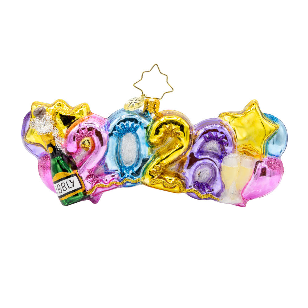 Cheers to 2026 ornament. "2026" shaped ballons in festive colors of pink, gold, blue and purple. Accompanied with a bottle of bubbles and flute glasses. View of front.