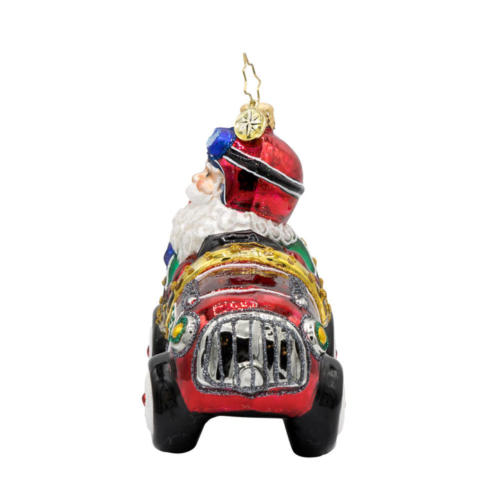 Kris Kringle Kart ornament. Santa speeds in a red racer car. View of right side.