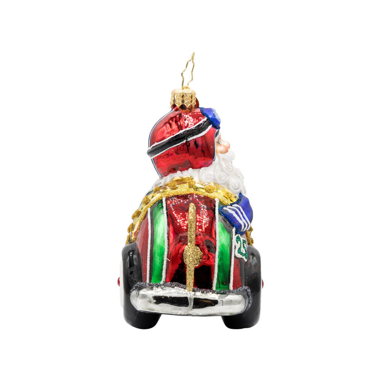 Kris Kringle Kart ornament. Santa speeds in a red racer car. View of left side.