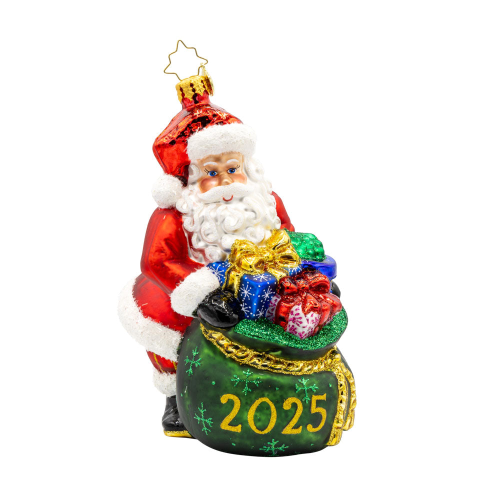 Santa's Yearly Gift Drop ornament. Santa holds an overflowing gift bag dated "2025." View of front.