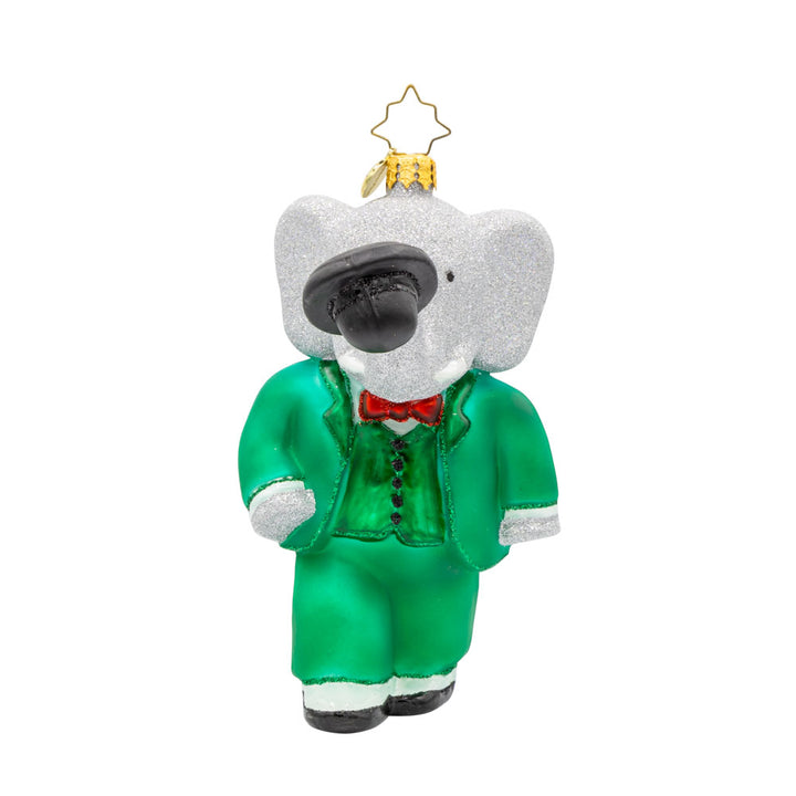 King Babar ornament. Babar dons his green suit, holding a top hat with his trunk. View of front. 