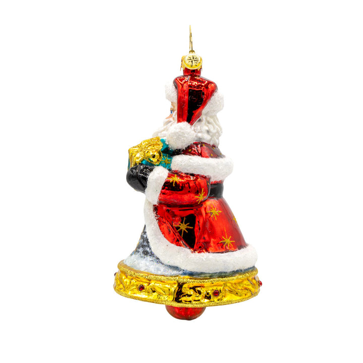 Jingle All The Claus ornament. The bottom of Santa's body creates a bell. The hand-painted scene on his coat features a snowy village and a twinkling Christmas tree. View of right side.