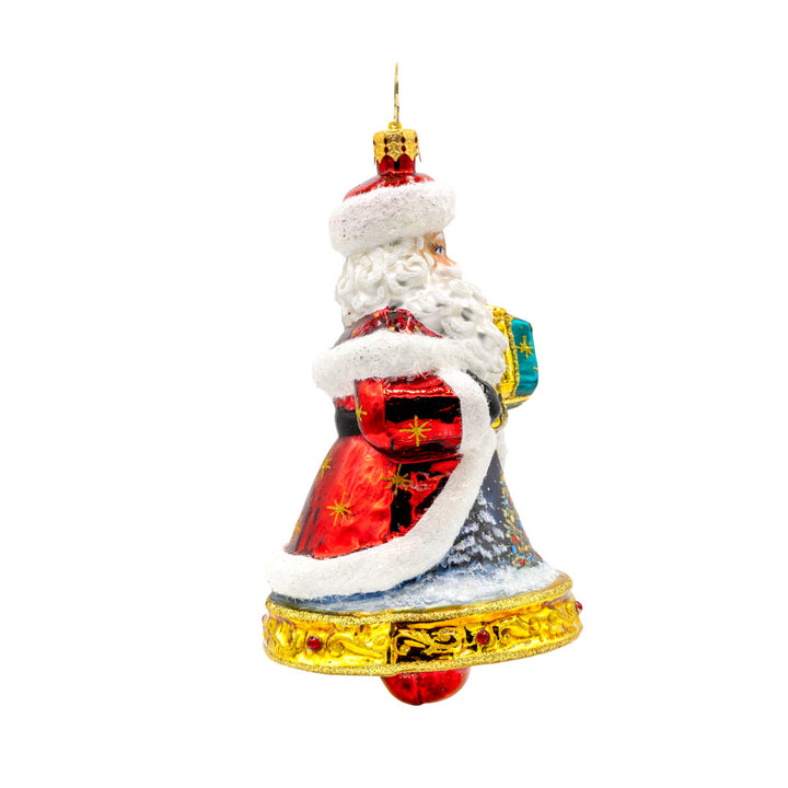 Jingle All The Claus ornament. The bottom of Santa's body creates a bell. The hand-painted scene on his coat features a snowy village and a twinkling Christmas tree. View of left side.