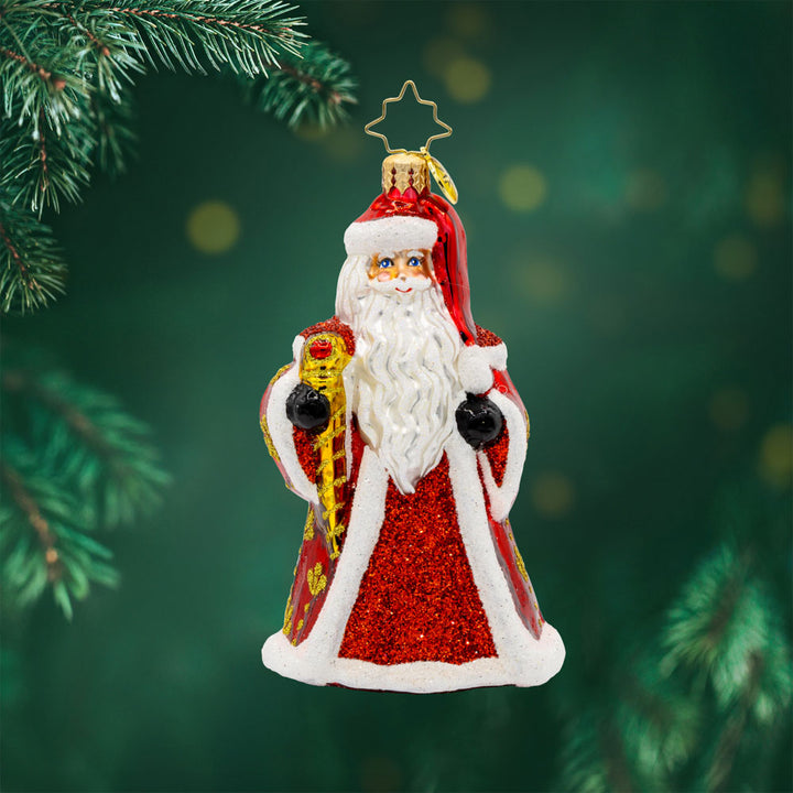 Jubilee Gent ornament. Santa is dressed in a regal red robe with his shiny scepter and festive cape. View of front.