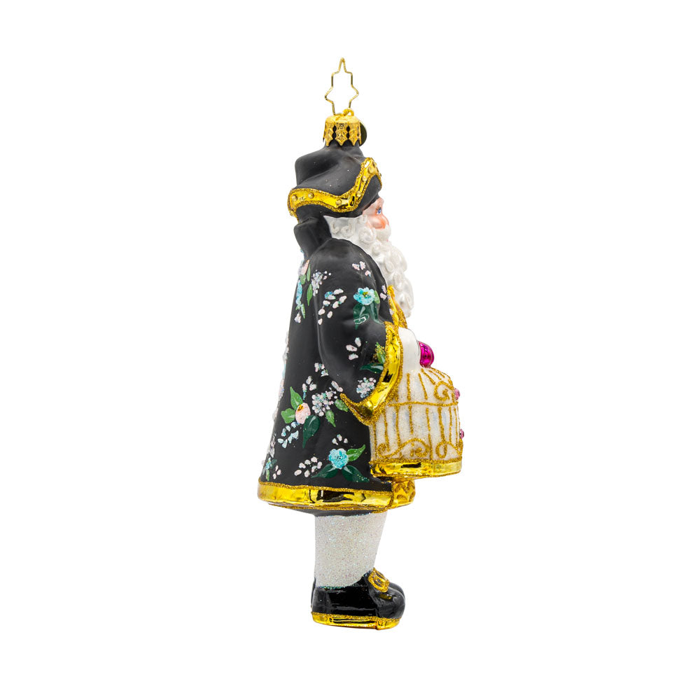 Chirp n Claus' ornament. Complete with a parrot and a gilded cage. Santa is dressed in a stylish black coat and hat. View of left side.