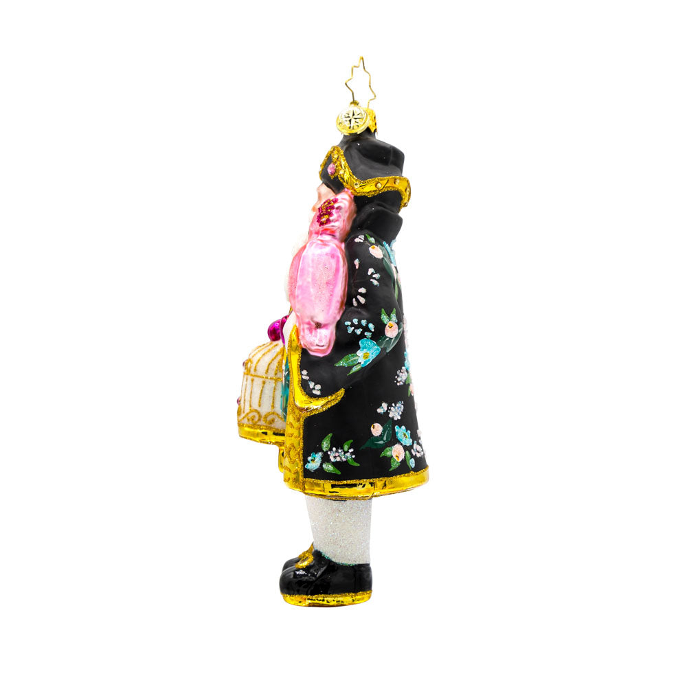 Chirp n Claus' ornament. Complete with a parrot and a gilded cage. Santa is dressed in a stylish black coat and hat. View of right side.