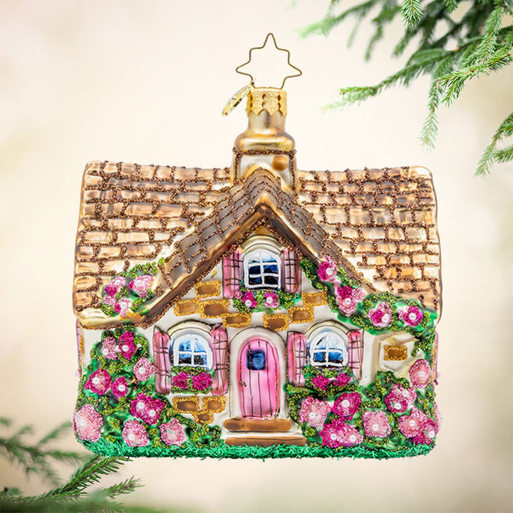 Floral Cottage Charm. Adorable cottage ornament bursting with colorful flowers. View of front. 