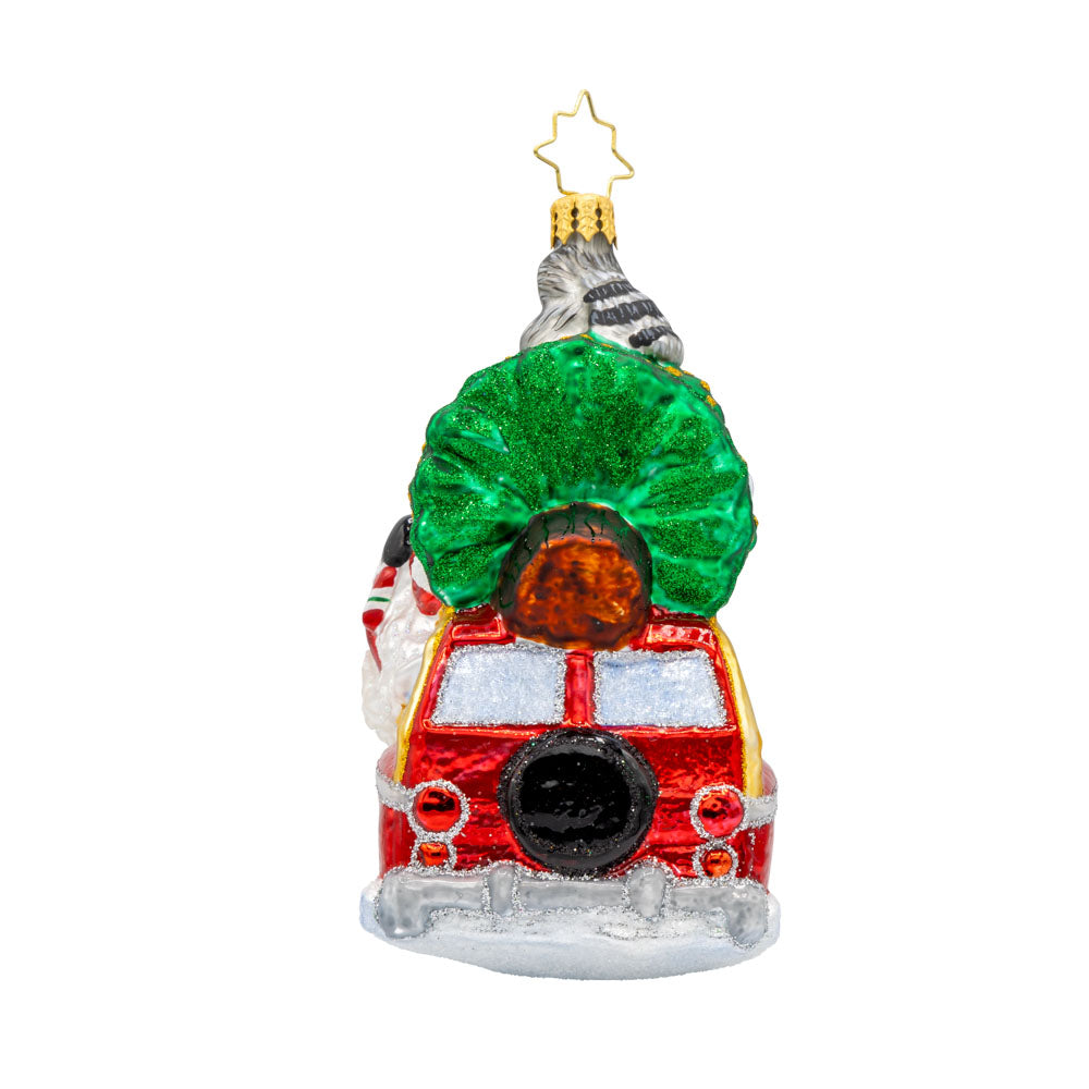 Santa's Woodland Adventure ornament. A raccoon catches a ride on the Christmas tree above Santa's car. View of right side.