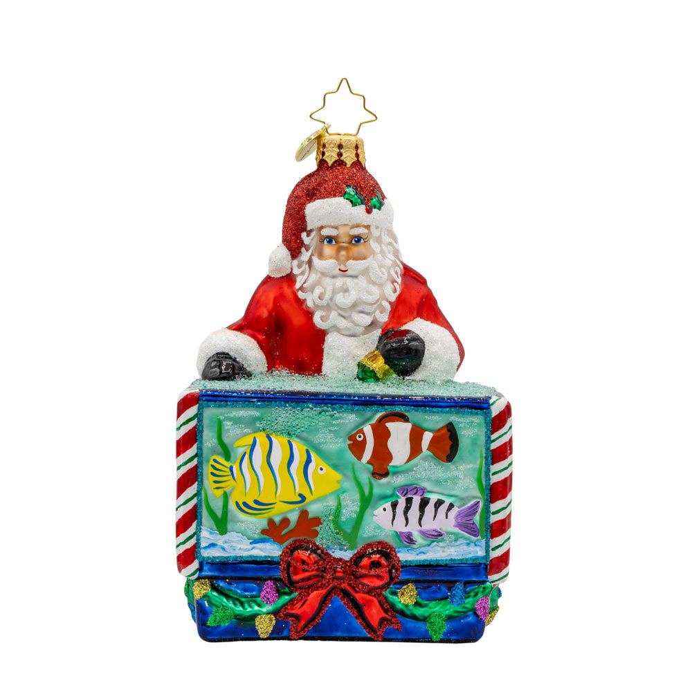 St. Nick's Nautical Nook ornament. Featuring Santa with a magical aquarium filled with colorful fish. View of front. 