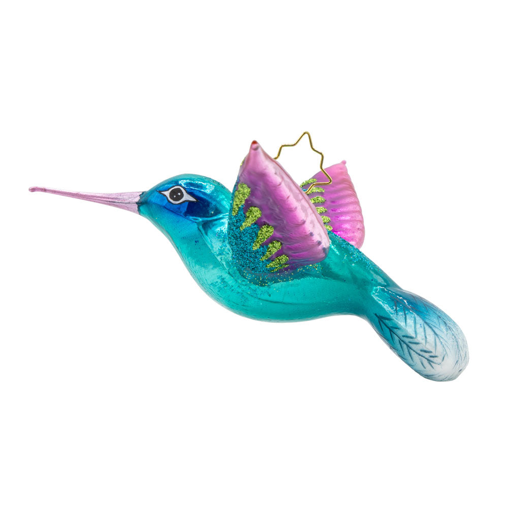 This Hummingbird Christmas ornament showcases a dazzling hummingbird with iridescent blue and fuchsia plumage. View of right side.