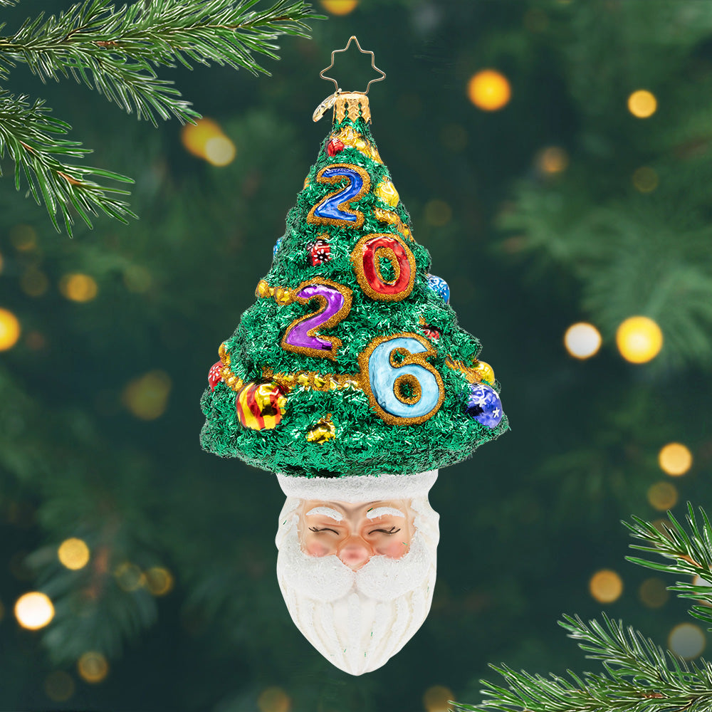 Santa's Sparkling 2026. Ornament of a decorated Christmas tree with the year 2026 on top of Santas head. view of front