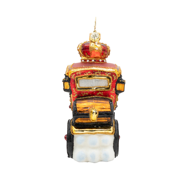 Back view ornament of Santa riding in a red and gold detailed carriage while being pulled by a brown reindeer. showcases back details of the treasure chest sitting on the back of the carriage.