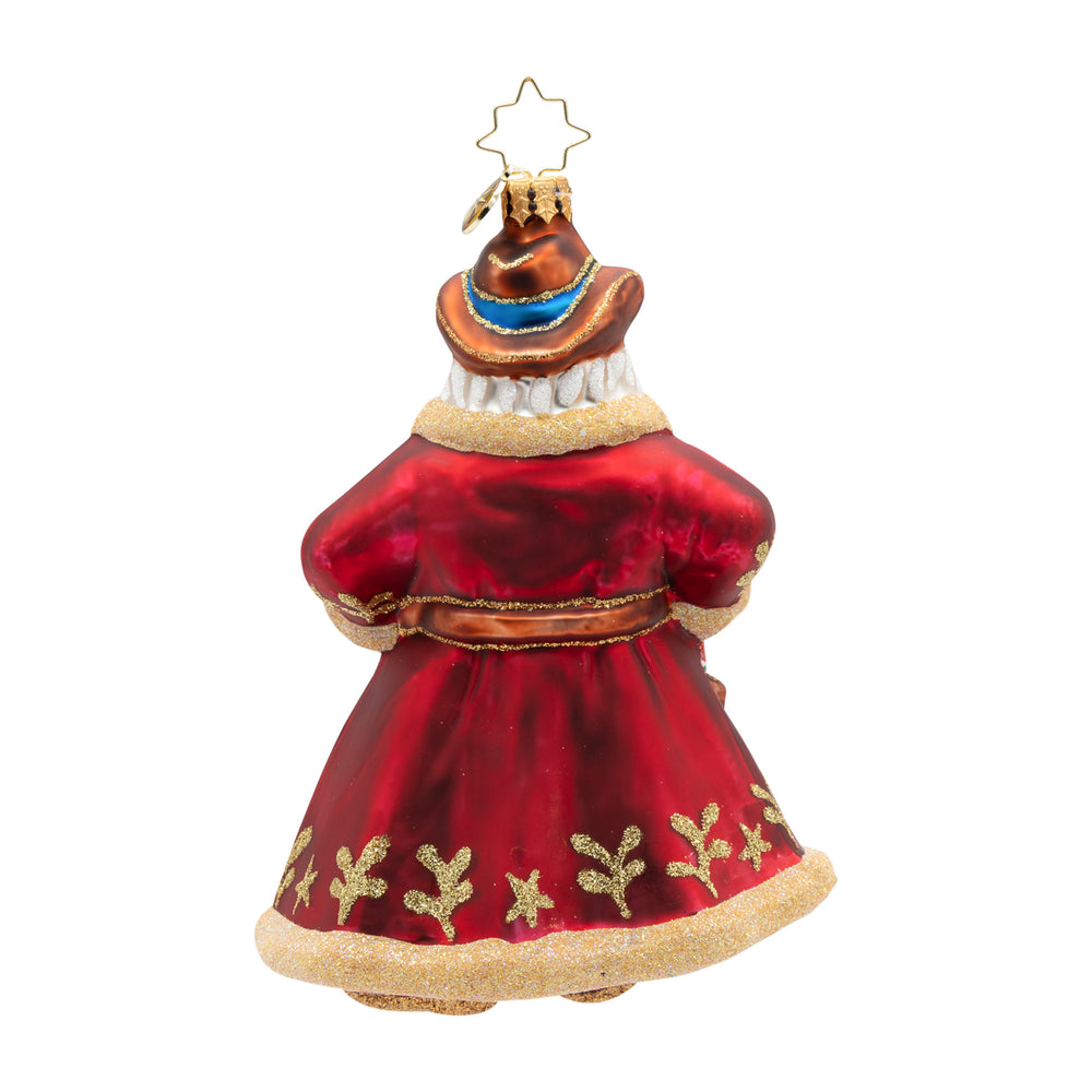 Back view  of decorative Christmas ornament in the shape of a red dress with gold accents on a white background