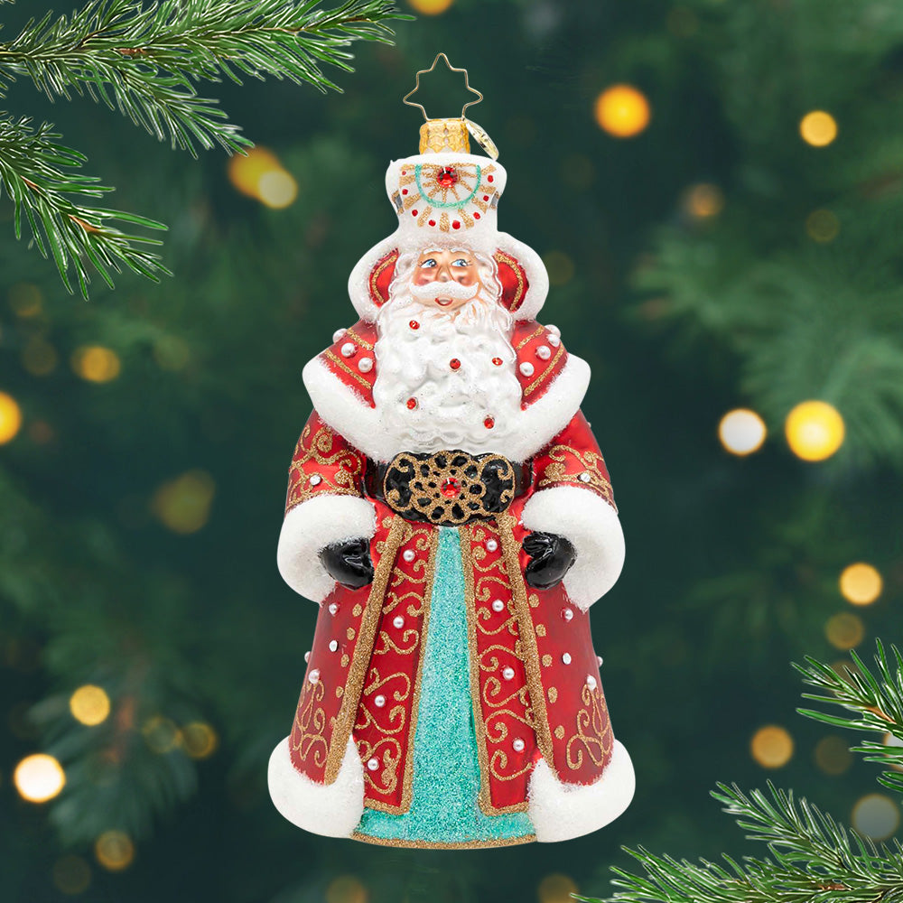Gilded Majesty Santa. Ornament of Santa in a robe adorned in rich red, gold filigree, and shimmering jewels. View of front