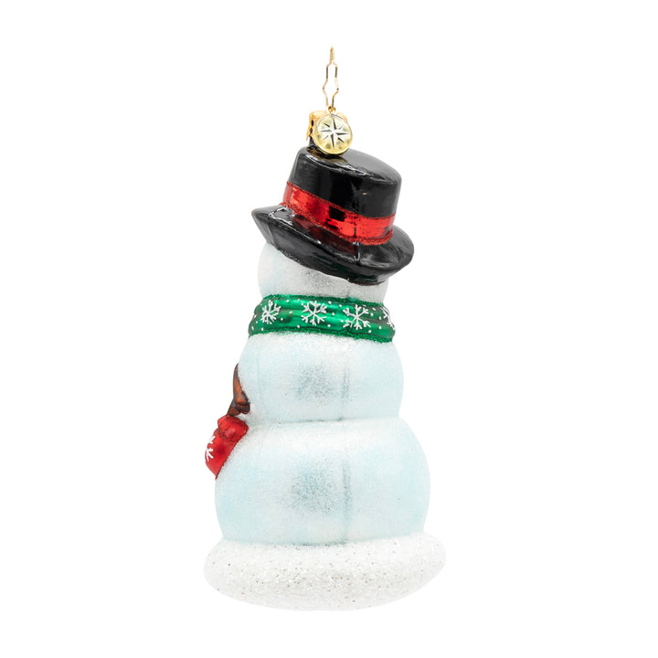 Side view of the ornament, showcasing the side of the snowman being built. 