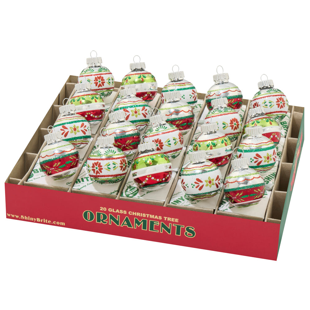 These traditional glass ornaments feature classic red, green and white colors, with intricate designs.