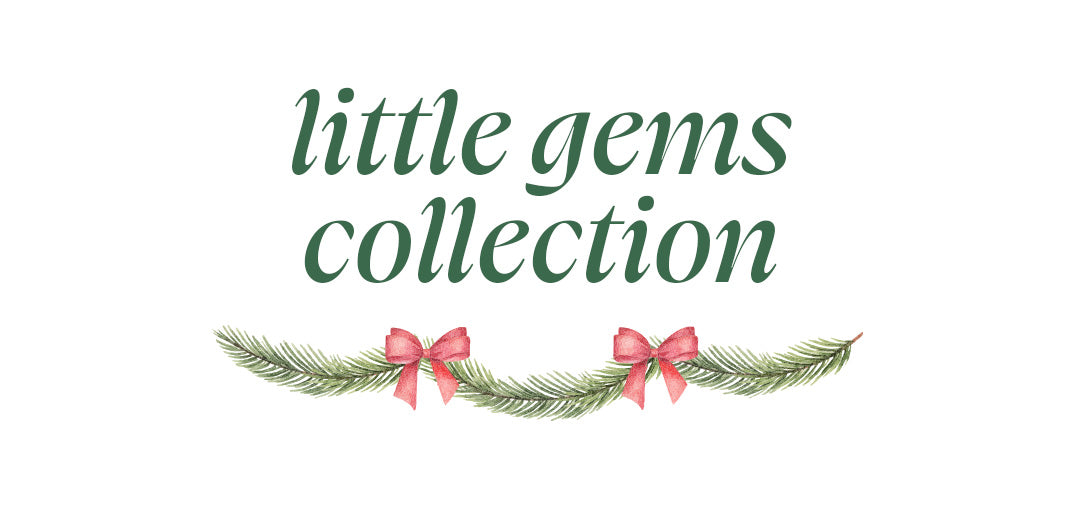 Section header reading "little gems collection" above an evergreen garland accent with red bows.