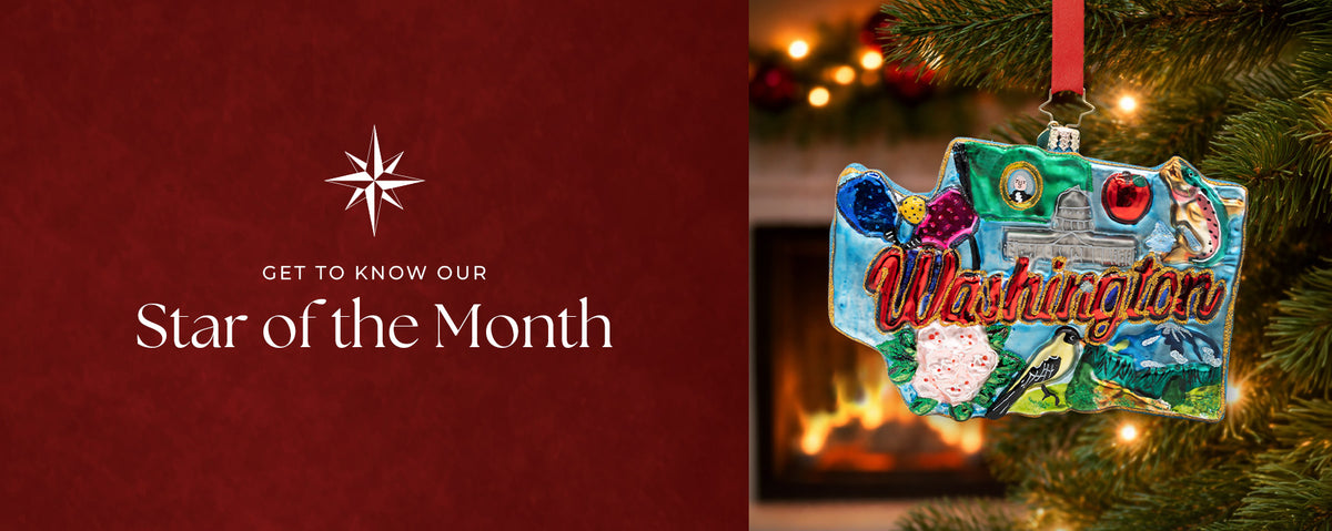 Promotional banner for "Star of the Month" featuring a Washington state-shaped glass Christmas ornament with state icons hanging on a lighted tree against a deep red background.