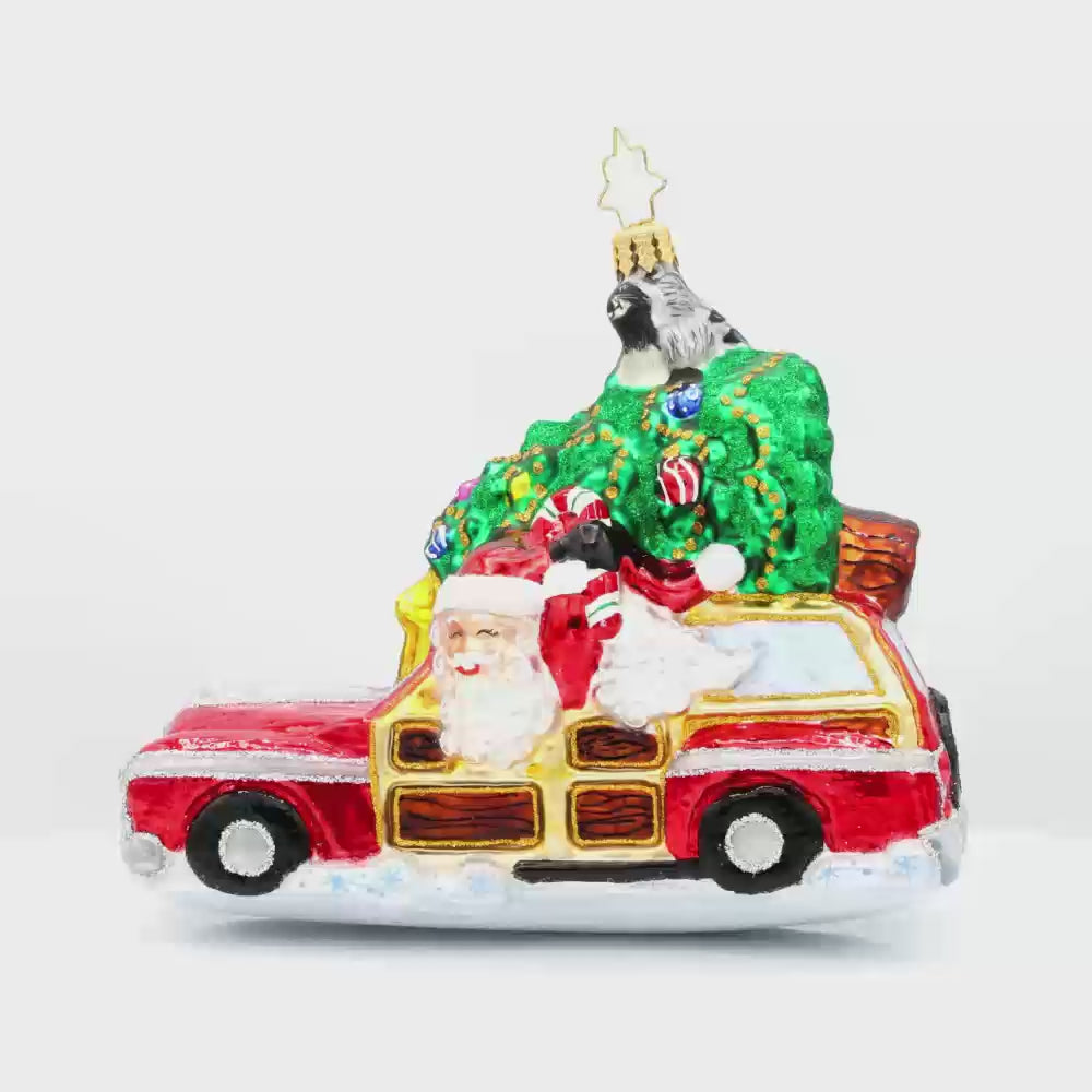 Santa's Woodland Adventure ornament. A raccoon catches a ride on the Christmas tree above Santa's car. Video.