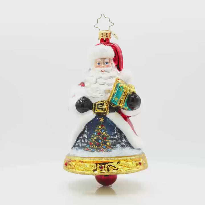 Jingle All The Claus ornament. The bottom of Santa's body creates a bell. The hand-painted scene on his coat features a snowy village and a twinkling Christmas tree. Video.