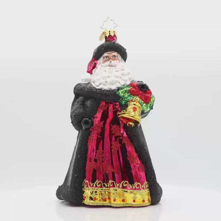 Bells of Christmas Santa ornament. Santa and his festive bell, dressed in a rich dark red gown with a shimmering pattern. Video.