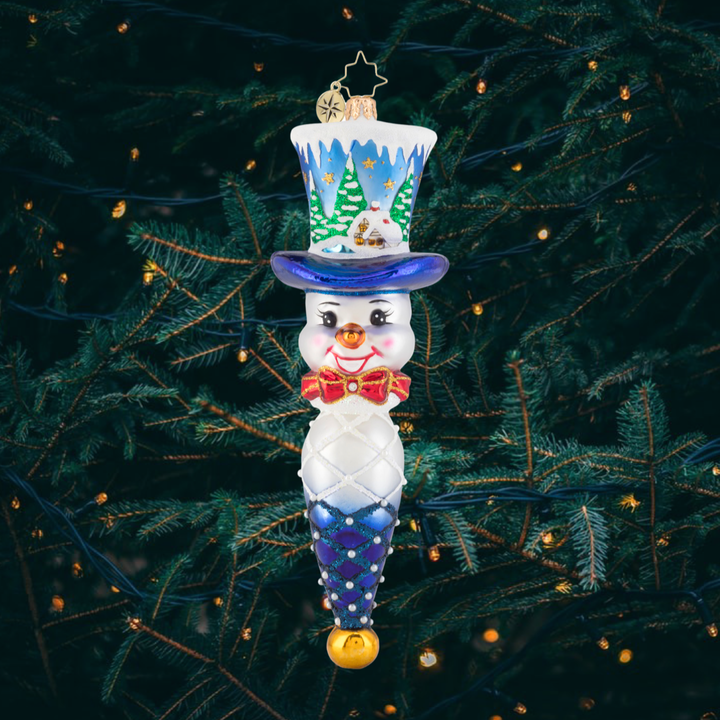 Ornament Description - Jolly Top Hat Snowman: Joy for all to hear! This dapper snowman is wearing a custom top hat, featuring a quaint little cottage in a forest of freshly fallen snow. Watch as an inquisitive young doe checks out this peaceful scene.