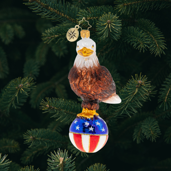 Ornament Description - Stars & Stripes Bald Eagle: Like an eagle who soars from coast to coast, from sea to shining seaâ€”it's good to be an American, living wild and free.
