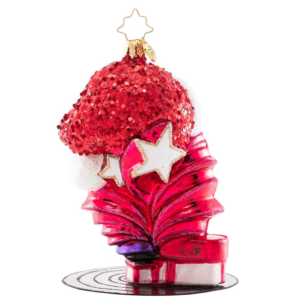 Back - Ornament Description - Elton John's Center Stage: Donning a Santa hat and his signature shades, Elton John takes center stage for a holiday concert of some of his greatest hits. He is ready to Step Into Christmas and will have the crowd Crocodile Rockin' in no time!
