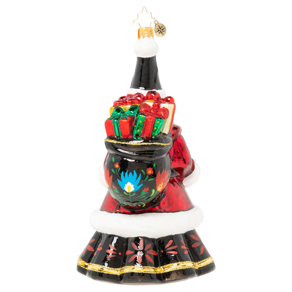 Back- Ornament Description - Festive Folk Santa: Santa puts a twist on traditional in this cozy ensemble fashioned in the style of beautiful European folk art. Our Designer's Choice ornament of the year looks like he could have stepped straight out of a Christmas fairytale!